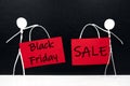 Stick man figure holding red Black Friday Sale door signage poster. Royalty Free Stock Photo