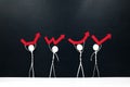 Stick man figures holding different rebound arrow shapes. Covid-19 pandemic crisis economic recovery concept. Royalty Free Stock Photo