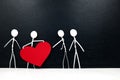 Stick man holding big red heart shape while giving to other people. Share love and kindness, give hope, helping others concept. Royalty Free Stock Photo