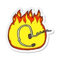 sticker of a burning headset cartoon