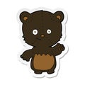 sticker of a cartoon black bearcub waving Royalty Free Stock Photo