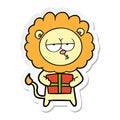 sticker of a cartoon bored lion with present Royalty Free Stock Photo