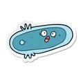 sticker of a cartoon germ