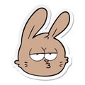 sticker of a cartoon jaded rabbit face Royalty Free Stock Photo