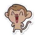 sticker of a cartoon laughing monkey