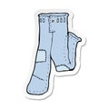 sticker of a cartoon patched old jeans