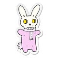 sticker of a cartoon spooky skull rabbit