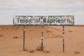 Sticker covered Tropic of Capricorn sign