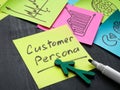 Sticker with customer persona and marker.