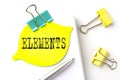 Sticker with ELEMENTS text on notebooks on the white background Royalty Free Stock Photo