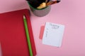 Sticker with handwritten text shopping list, notepad and pencil on pink background Royalty Free Stock Photo