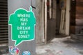 Sticker on a Hong Kong lampost asking `Where has my dream city gone?`