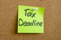 A sticker with the inscription tax deadline is pinned to the board. Royalty Free Stock Photo