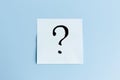 The sticker with question mark on blue background. The concept of finding answers to questions and solving problems Royalty Free Stock Photo