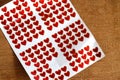 Sticker Small red heart on white paper over