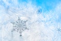 Sticker snowflakes on ice frosted window glass with blue sky seen in the background Royalty Free Stock Photo