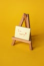 Sticker with sorry inscription on a mini easel