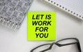 Sticker with text Let is Work For You notepad and eyeglasses. Here can be your text Royalty Free Stock Photo