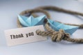 Sticker with thank you thick braided rope and ship paper origami Royalty Free Stock Photo