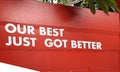 Sticker white color word is a Our best just got better on red wall for succession service industry business and commercial