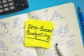 Sticker with words zero based budgeting on the open notepad. Royalty Free Stock Photo
