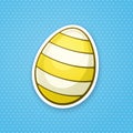 Sticker yellow Easter egg with stripped pattern