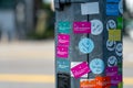 Stickers on lamp post , Singapore street.