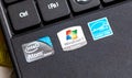 Stickers, manufacturer production labels on a laptop palmrest closeup. Windows 7 Starter logo, Intel Atom, Energy Star symbols Royalty Free Stock Photo