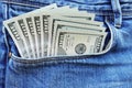 Sticking out money from blue jeans pocket, spending money concept Royalty Free Stock Photo