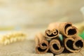 Sticks and powder aroma cinnamon on old wooden background Royalty Free Stock Photo