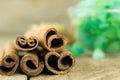 Sticks and powder aroma cinnamon on old wooden background Royalty Free Stock Photo