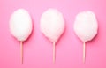 Sticks with yummy cotton candy on color background Royalty Free Stock Photo