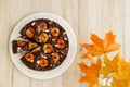 Sticky Chocolate Plum Cake with Autumn Decoration Royalty Free Stock Photo