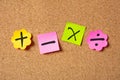 Sticky colorful notes in flower shape, isolated, with math symbols on corkboard