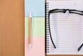 sticky note, ballpoint pen, empty notebook, eyeglasses on office Royalty Free Stock Photo