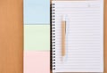 sticky note, ballpoint pen, empty notebook on office desk. business, education concept. Top view with copy space. selective focus. Royalty Free Stock Photo