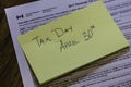 Sticky Note on Canadian Tax Form to show Canada Tax Day