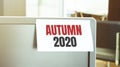 Sticky note on the computer. Text Autumn 2020