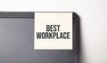 Sticky note on the computer. Text BEST WORKPLACE Royalty Free Stock Photo