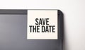 Sticky note on the computer. Text Save the Date Royalty Free Stock Photo