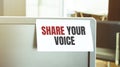 Sticky note on the computer. Text SHARE YOUR VOICE Royalty Free Stock Photo