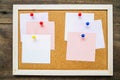 Sticky note on cork board on wooden wall background,empty space Royalty Free Stock Photo