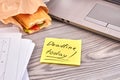 Sticky note with deadline today writing and baguette. Royalty Free Stock Photo