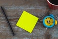 Sticky note with empty space for a text and Cup of coffee on wo Royalty Free Stock Photo