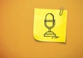 Sticky Note with Microphone Icon against orange background