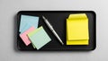 Sticky note pad is visible. The pen is positioned between the Royalty Free Stock Photo