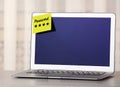 Sticky note with password on laptop indoors. Space for text Royalty Free Stock Photo