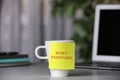 Sticky note with phrase Reset Password on cup indoors Royalty Free Stock Photo