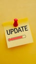 Yellow sticky note with UPDATE text and red progress bar, symbolizing progress Royalty Free Stock Photo