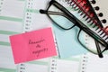Sticky note and eyeglasses on a calendar Royalty Free Stock Photo